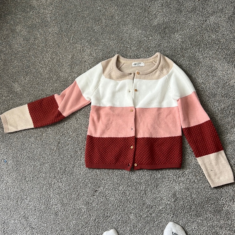 pink, red, and white button up cardigan